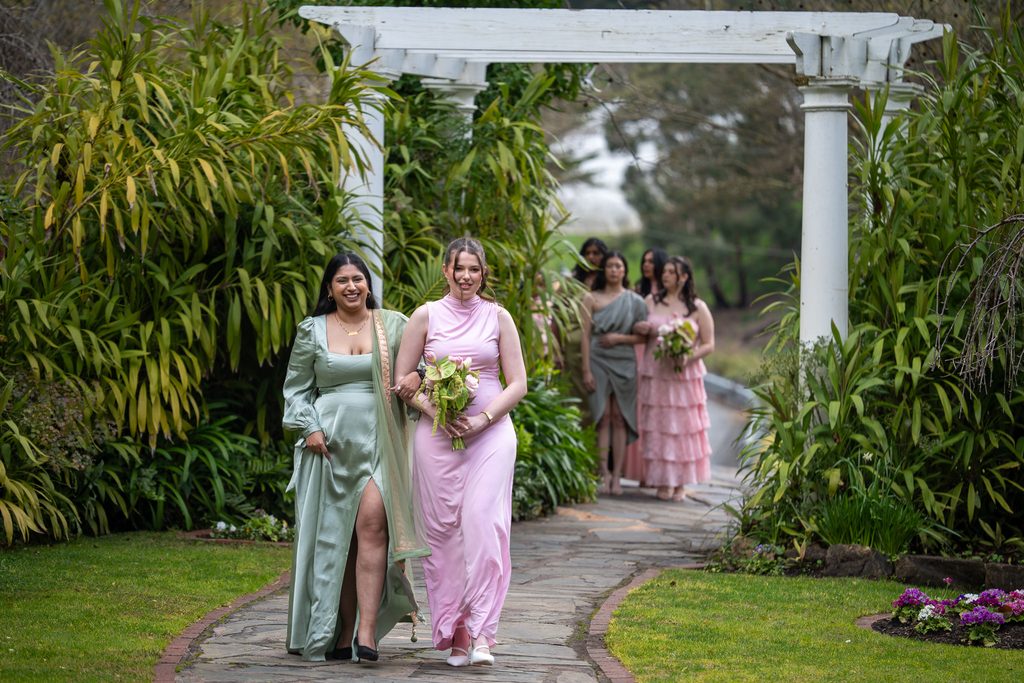 Bridal party walking along the footpath at The Manor
