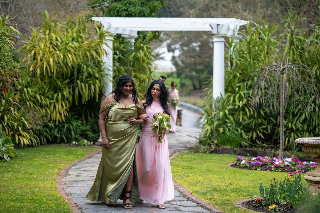 Bridal party walking along the footpath at The Manor