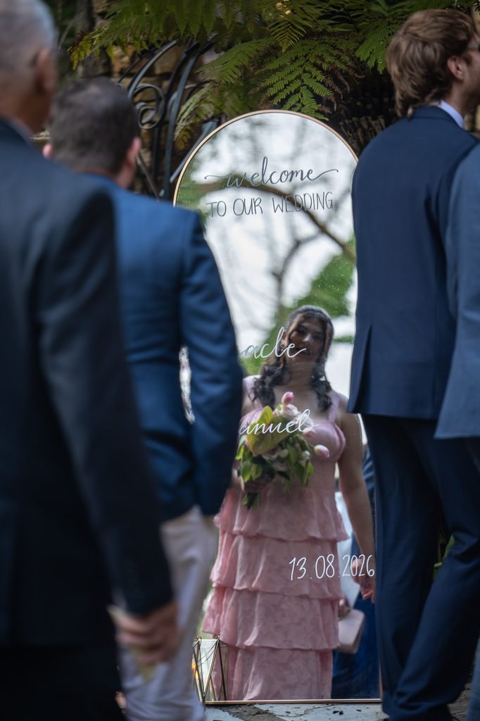 Mirror reflection of a bridemaid