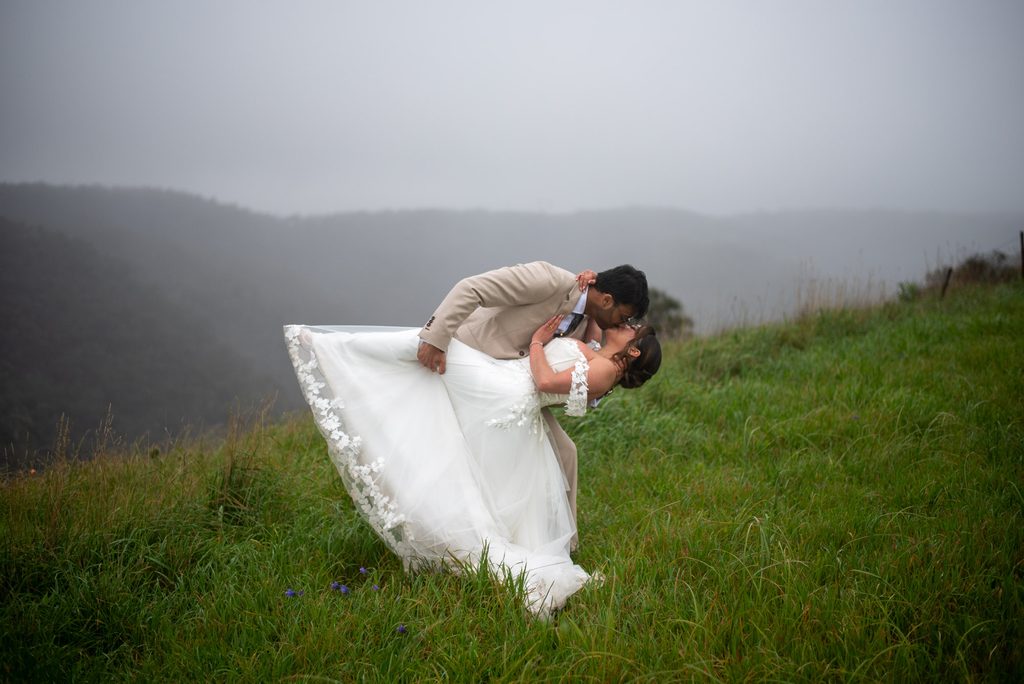 Emmanuel and Miracle, a bending down kiss on a hillside