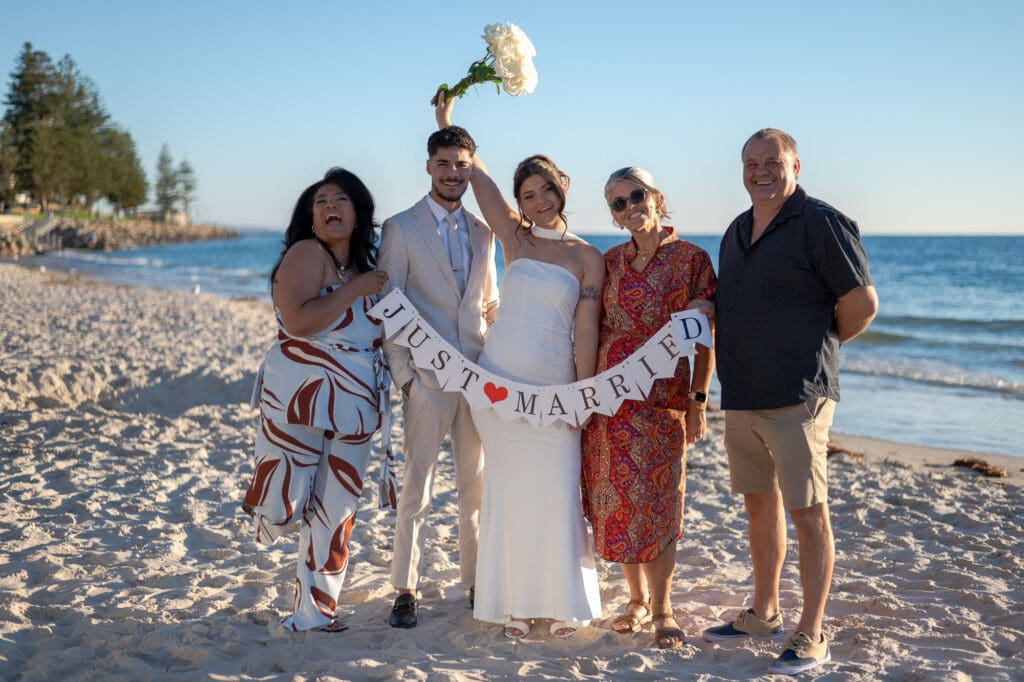 Halley and Jay wedding photos at Glenelg Beach just married